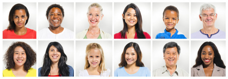 A group of multi-ethnic people. Individual photo boxes are arranged in an array. The boxes each contain a head-and-shoulders picture of a person smiling against a light gray background. The people are both male and female and range from young children to older adults.