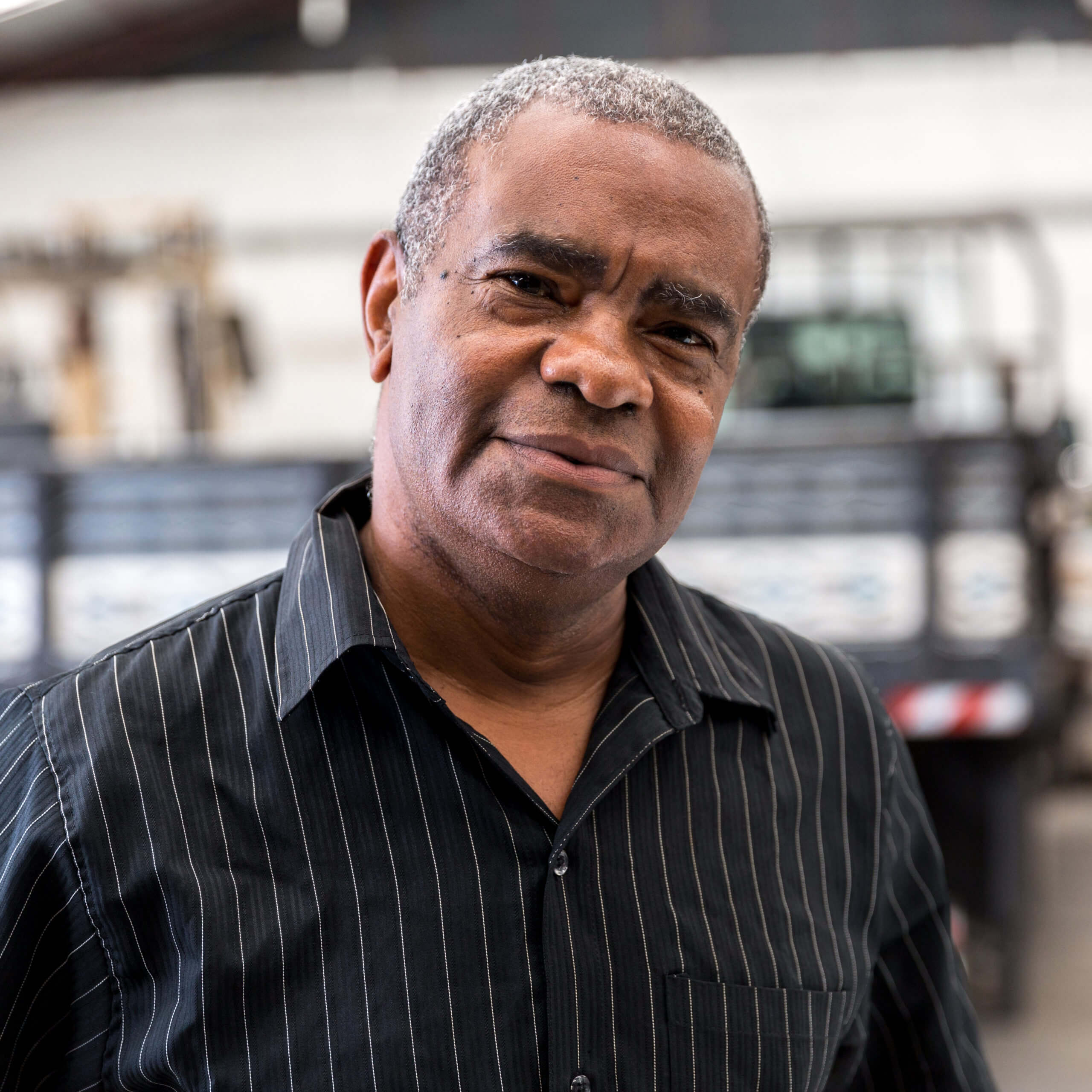 Portrait of Worker on Factory on background