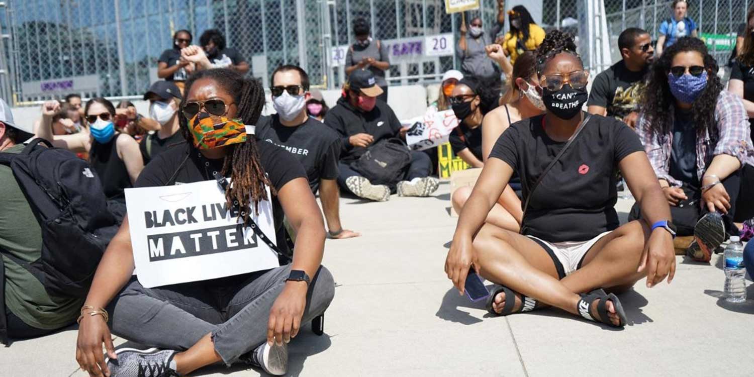 Seated group of people participating in Black Lives Matter protests