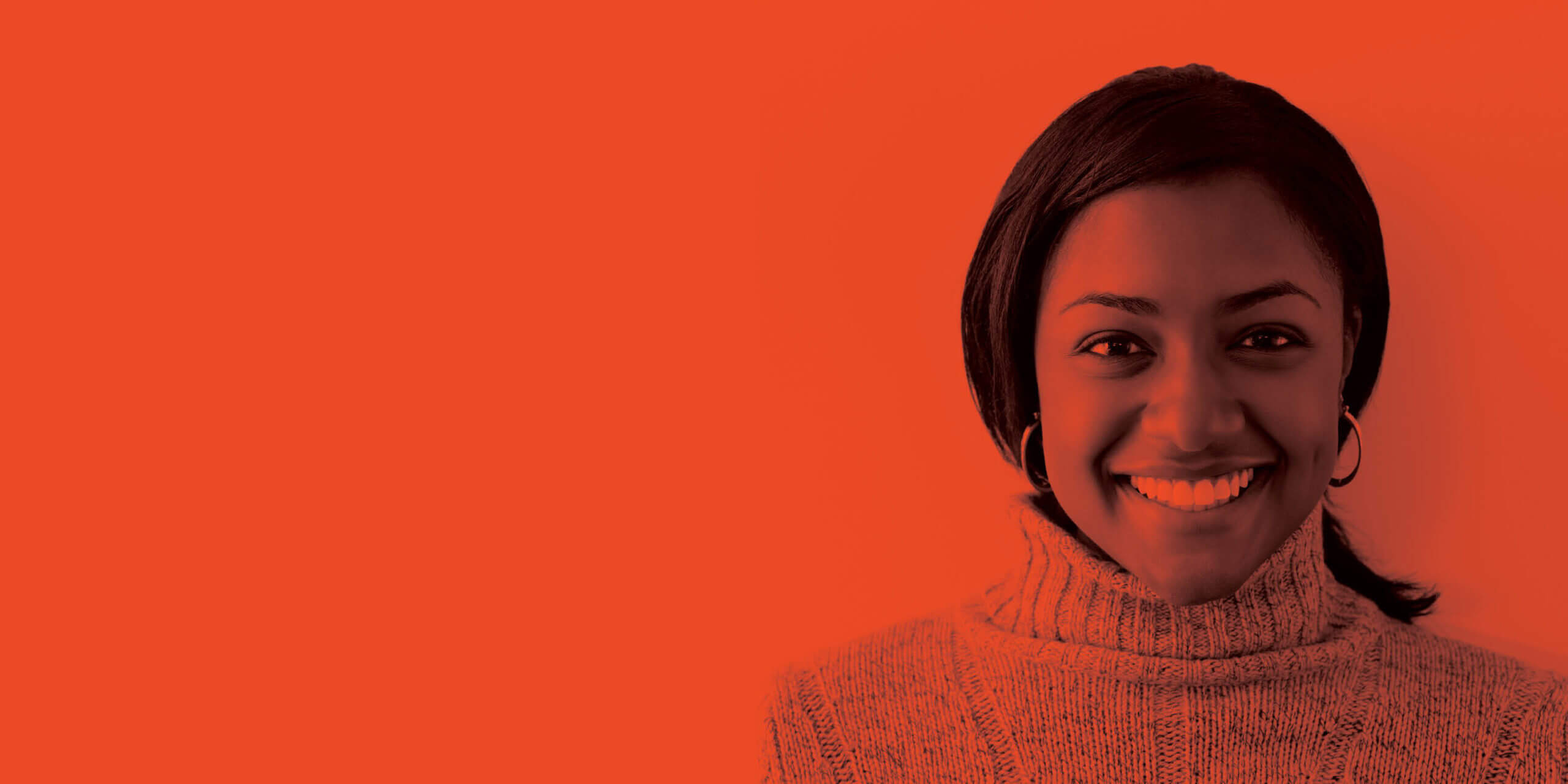 African American woman smiling at camera on blank background