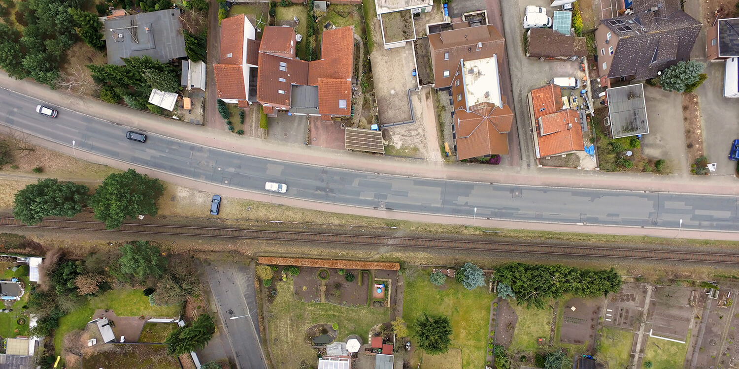 Aerial view of an old housing estate on the outskirts of the city with railway tracks close to the buildings